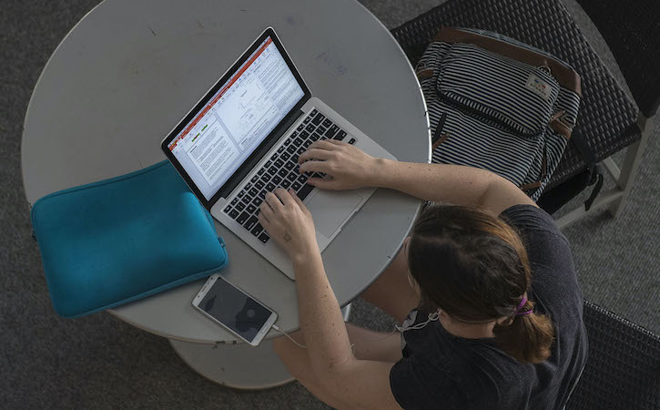 Overhead view of student at computer